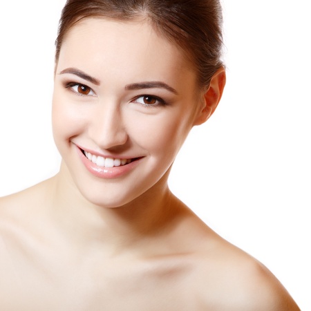 Beauty portrait of young fresh smiling girl. Isolated on white background の写真素材