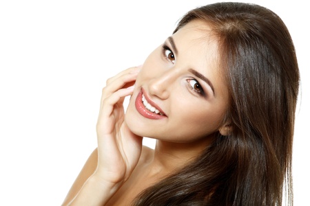 Beauty portrait of beautiful happy smiling young fresh woman and long brown hair. Isolated on white background の写真素材