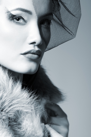 Beautiful woman with veil looking at camera retro glamour beauty portrait, tonedの写真素材