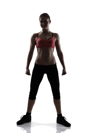 sport woman full length portrait, silhouette studio shot over white backgroundの写真素材