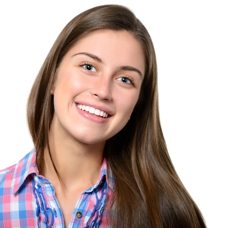 portrait of attractive teenager girl smiling in cheerful mood, over whiteの写真素材