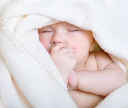cute sleeping baby boy, beautiful infant face closeupの写真素材