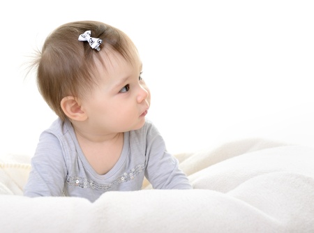 portrait of cute little girl toddler, 10 month, studio over whiteの写真素材