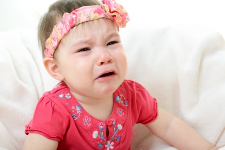 portrait of crying baby girlの写真素材