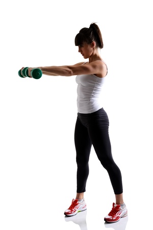 sport girl doing with exercise dumbbells, fitness woman studio shot in silhouette technique over white backgroundの写真素材