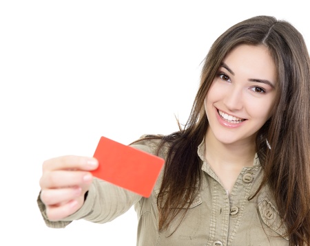 beautiful friendly smiling confident girl showing red card in hand, over white backgroundの写真素材