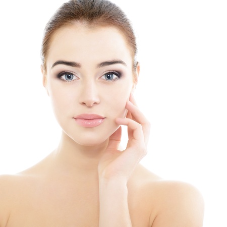 beauty girl portrait, young beautiful woman portrait with clean skin holding hand near face, over white studio shotの写真素材