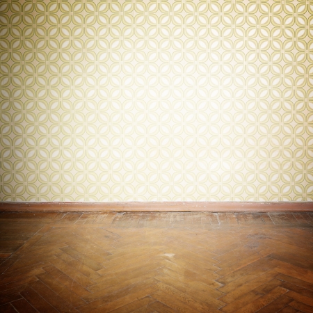 Vintage room, empty retro apartment with old fashioned wallpaper and weathered wooden parquet floor, tonedの写真素材