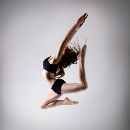 young beautiful dancer teen girl dancing and jumping, studio seriesの写真素材