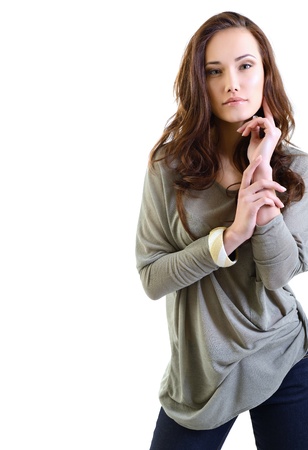 Beautiful young woman with beauty long brown hair posing at studio, face closeup over whiteの写真素材