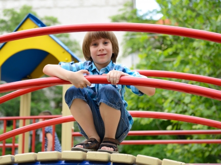 children playing on  playground in summer outdoor parkの写真素材