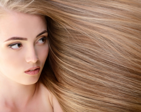 Hair. Beautiful bond girl with healthy long hair. Haicare and hairstyle.の写真素材