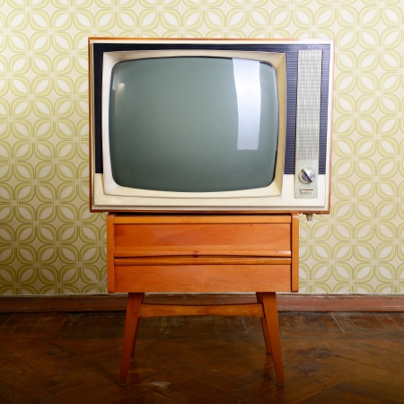 retro tv with wooden case in room with vintage wallper and parquetの写真素材