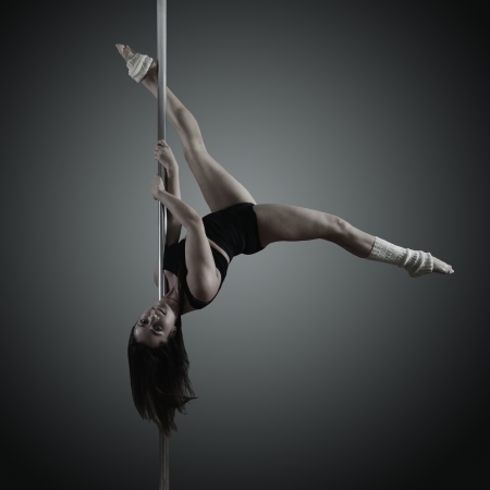 pole dancer, young woman dancing on pylon, toned and noise addedの写真素材