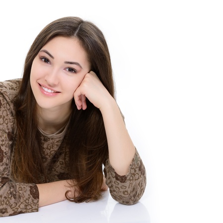 full length portrait of attractive teen girl looking at camera over whiteの写真素材