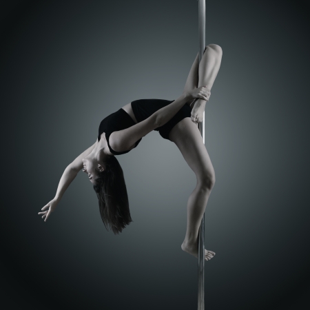 pole dancer, young woman dancing on pylon, toned and noise addedの写真素材