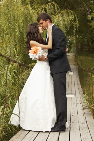 young wedding couple, beautiful bride with goom, summer nature outdoorの写真素材