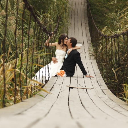 young wedding couple, beautiful bride with goom, summer nature outdoorの写真素材