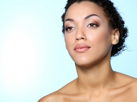 Beauty portrait of young mulatto fresh fashion woman with beautiful makeupの写真素材
