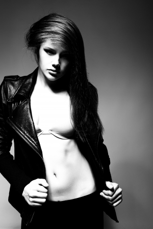 Fashion girl, portrait of young woman posing at studio, tonedの写真素材