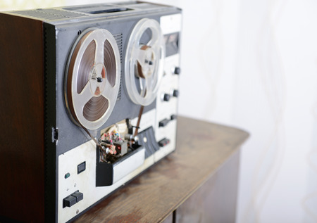 Old portable reel to reel tube tape-recorder, toned, with copyspace