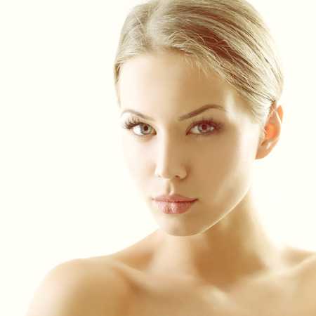 Beauty portrait of young woman with beautiful healthy face, studio shot of attractive girl, tonedの写真素材