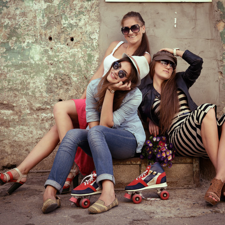 Girls having fun together outdoors, urban lifestyle, image tonedの写真素材