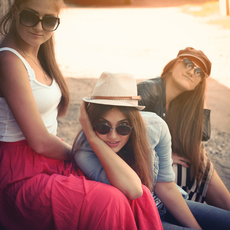 Girls having fun together outdoors, urban lifestyle, image filteredの写真素材