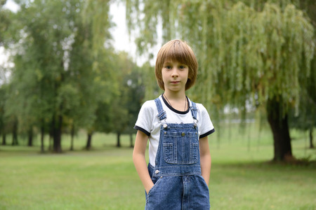 Cute little boy in summer park, nature outdoor, tonedの写真素材