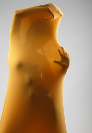 perfect sexy female body in yellow fabric, front viewの写真素材