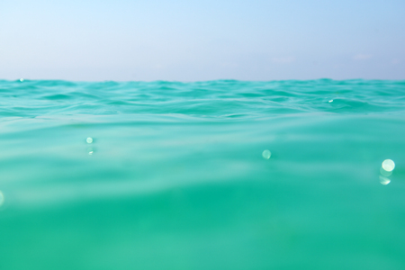 clean turquoise sea wave close upの写真素材
