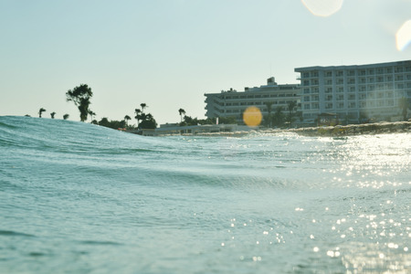 sea wave against tropical holiday resortの写真素材