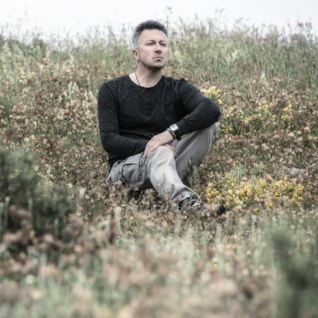 Handsome man. Outdoor male portrait. Image toned.
