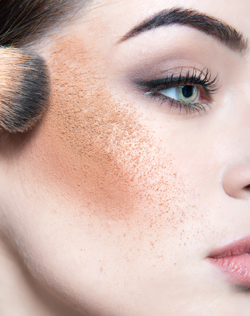 Beautiful female face closeup. Makeup. Make-up artist working. Girl with creative make up, detail.の写真素材