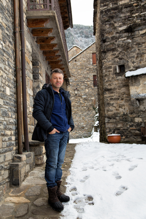 Man in ancient medieval city Broto, Spain.