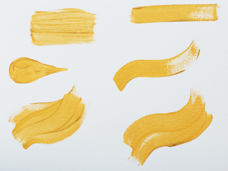 Golden strokes, oil painting on canvas. Stripes. Artistic background, stains set.の写真素材