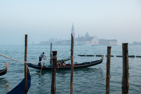 Grand Ð¡hannel with gondola and gondolier, Venice, Italy. Beautiful ancient romantic italian city.の写真素材