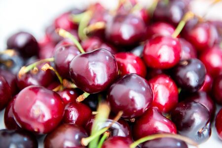 Fresh raw ripe juicy sweet cherries, soft focus. Farm seasonal spanish fruits and vegetables