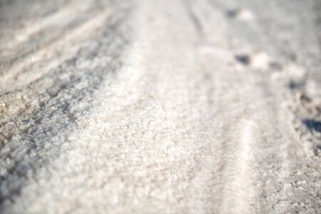 Salt mining. Salty pink lake with crystals of salt. Extremely salty pink lake, colored by microalgae with crystalline salt depositions in Torrevieja, Spainの写真素材