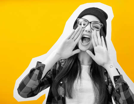 Girl screaming like in megaphone holding hands near her face with open mouth, collage in magazine...