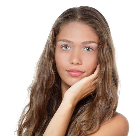 Portrait of a beautiful young woman with clean skin and long curly fair hair, beauty treatment, cosmetology and anti-aging themeの写真素材