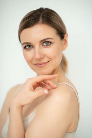 Beautiful calm middle aged woman, natural light. Anti-aging and beauty treatment.の写真素材