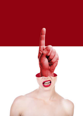 Beautiful young woman holding bullet in her teeth and shifted upper part of the head and index finger of the big male hand inside. Ð¡ontemporary art collage, trendy urban magazine style.の写真素材