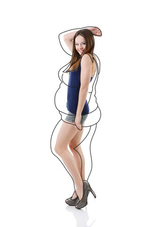 Attractive slim girl, full length portrait isolated on white background with contours of an overweight woman drawn around. Healthy eating, diet, sport and slimming conceptの写真素材