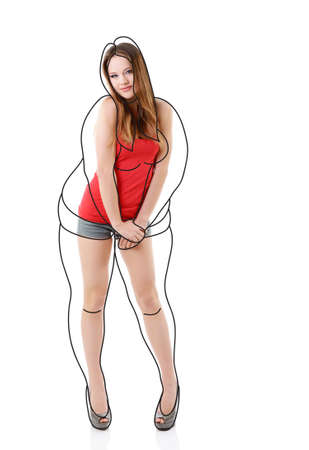 Attractive slim girl, full length portrait isolated on white background with contours of an overweight woman drawn around. Healthy eating, diet, sport and slimming conceptの写真素材
