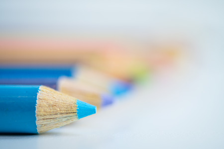 Color pencils line up with blue in the front