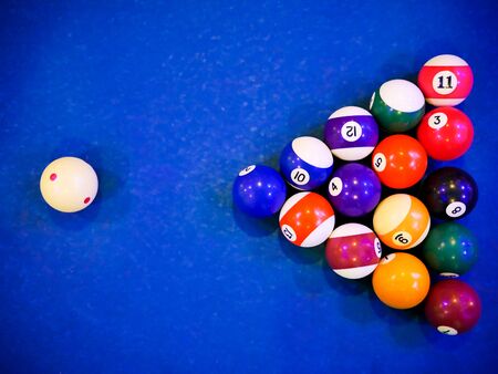 billiard snooker pyramid balls on pool blue table