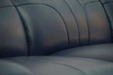 Blue leather couch sofa in detail. Interior furniture showroom photograpy.