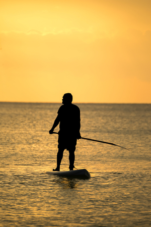 Silhouette Man with kayak boat sailingの写真素材