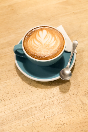 latte coffee on wood tableの写真素材